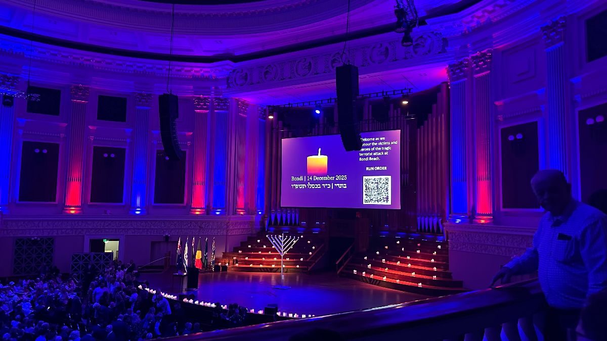 Inside the Solidarity Event Brisbane with dim lights and Candles Glowing