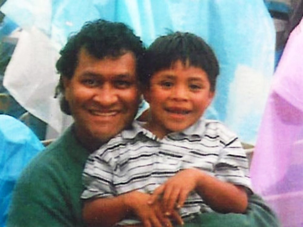 Almolonga, Guatemala: Norman Miller with a boy at a rally, 1998